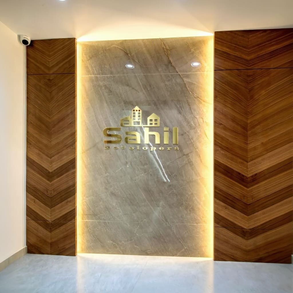 Backlit Marble Logo Panel with Chevron Wood Office Entrance Wall